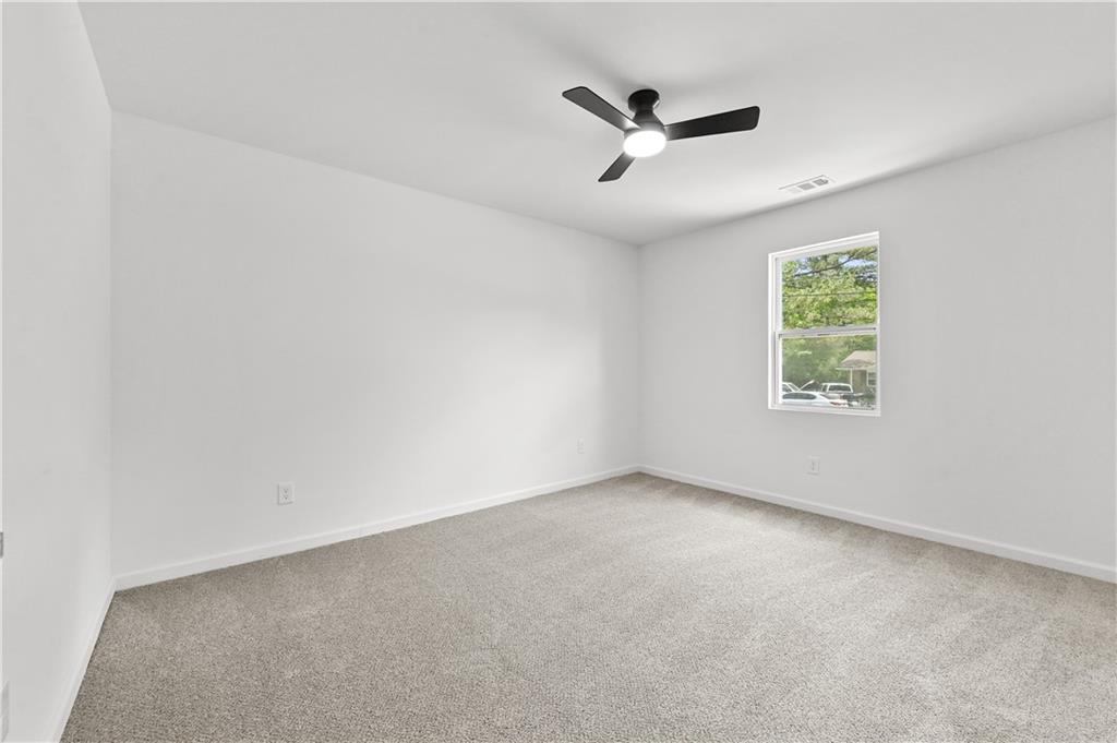 140 Buckhurst Way South Fulton, GA 30349 - Photo 25 of 45 an empty room with window and windows