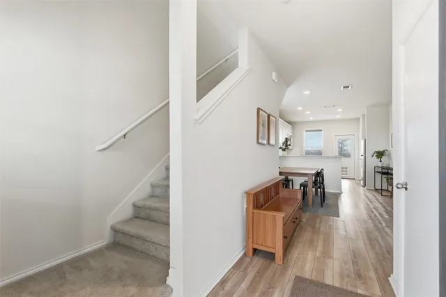 a view of dining room with furniture and wooden floor
