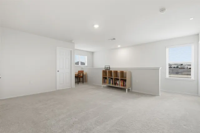 a view of a room with appliances and a window