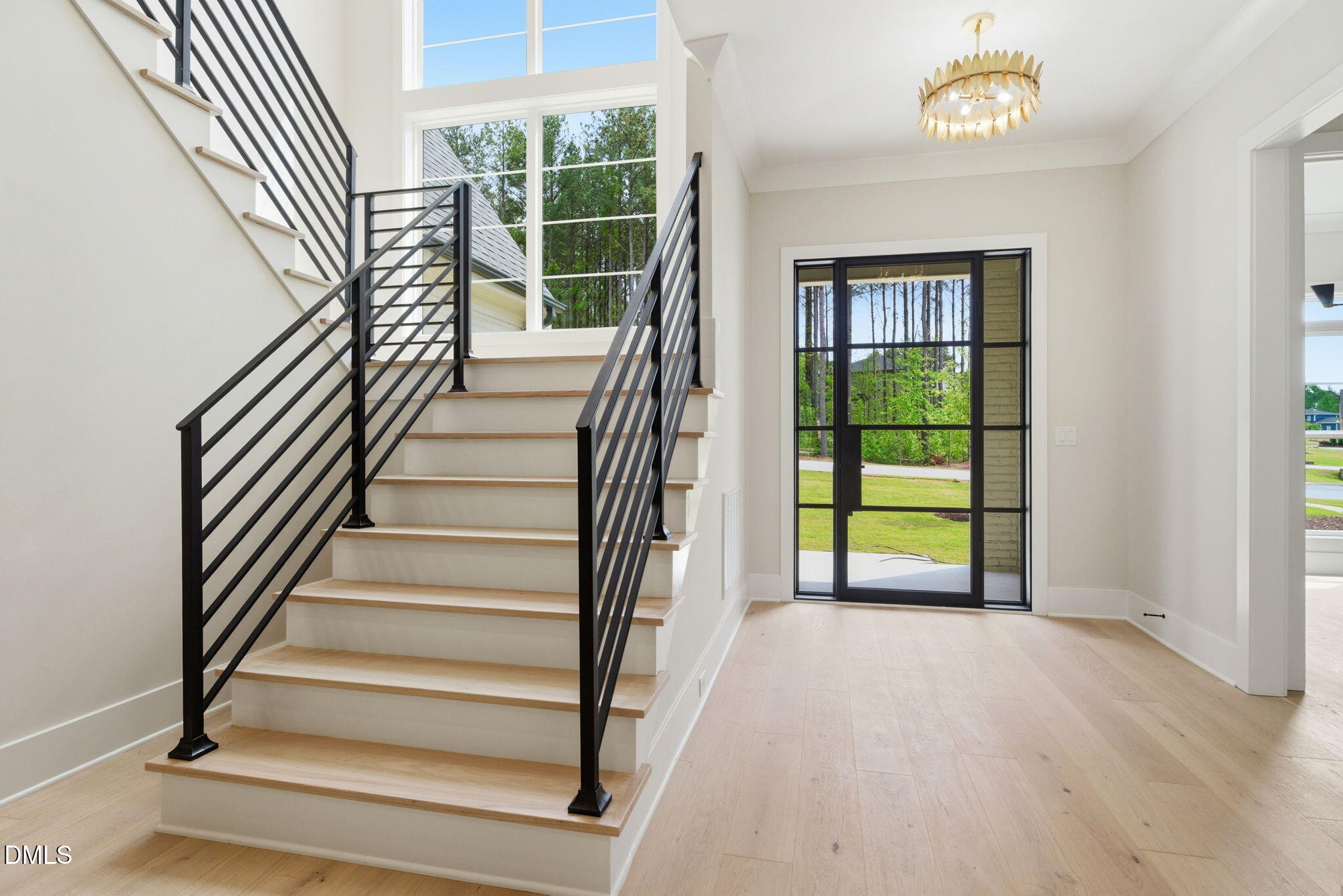 1304 Sanctuary Pond Drive Raleigh, NC 27606 - Photo 4 of 52 a view of entryway and hall with wooden floor