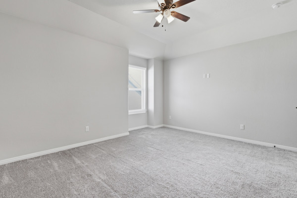 3604 Chaff Lane Pflugerville, TX 78660 - Photo 18 of 26 a view of an empty room with a chandelier fan