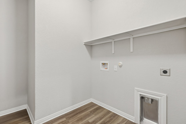 3604 Chaff Lane Pflugerville, TX 78660 - Photo 23 of 26 a view of small space with racks on the wall