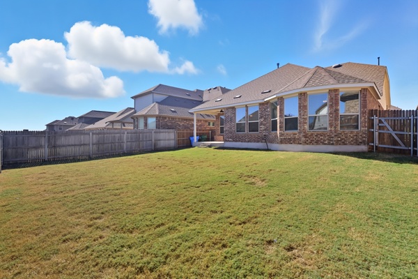 3604 Chaff Lane Pflugerville, TX 78660 - Photo 24 of 26 a view of a house with a yard