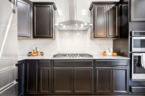 3604 Chaff Lane Pflugerville, TX 78660 - Photo 6 of 26 a kitchen with stainless steel appliances a stove and a refrigerator