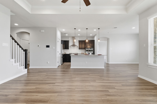 3604 Chaff Lane Pflugerville, TX 78660 - Photo 10 of 26 a view of kitchen with cabinets and wooden floor