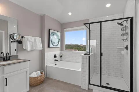 a bathroom with a bathtub and a shower