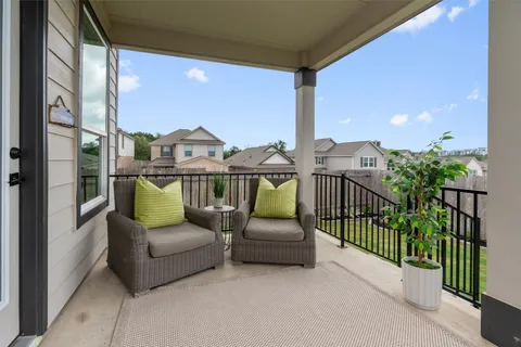 a view of a balcony with furniture