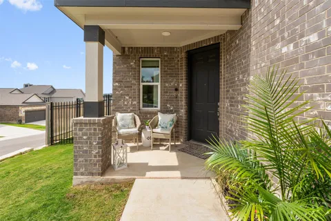 a front view of a house with outdoor seating