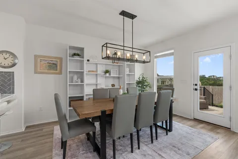 a view of a dining room with furniture window and wooden floor