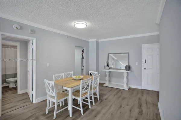 a kitchen with a table and chairs in it