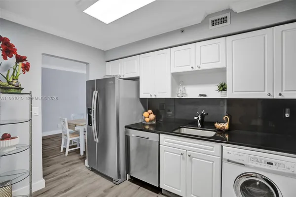 a kitchen with a sink and cabinets