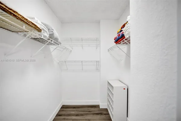 a view of a room with racks on the wall