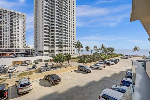 a balcony view with a seating space