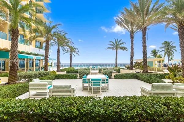 a view of swimming pool with outdoor seating