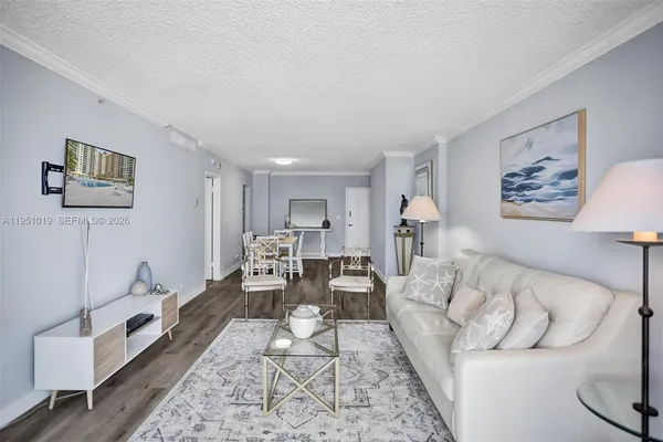 a living room with furniture and a rug