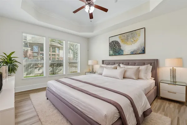 a bedroom with a large bed and a window