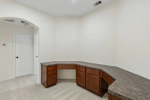 a bedroom with a bed and a potted plant