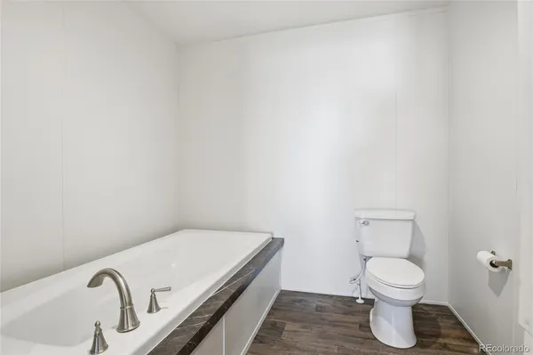 a bathroom with a toilet and a sink