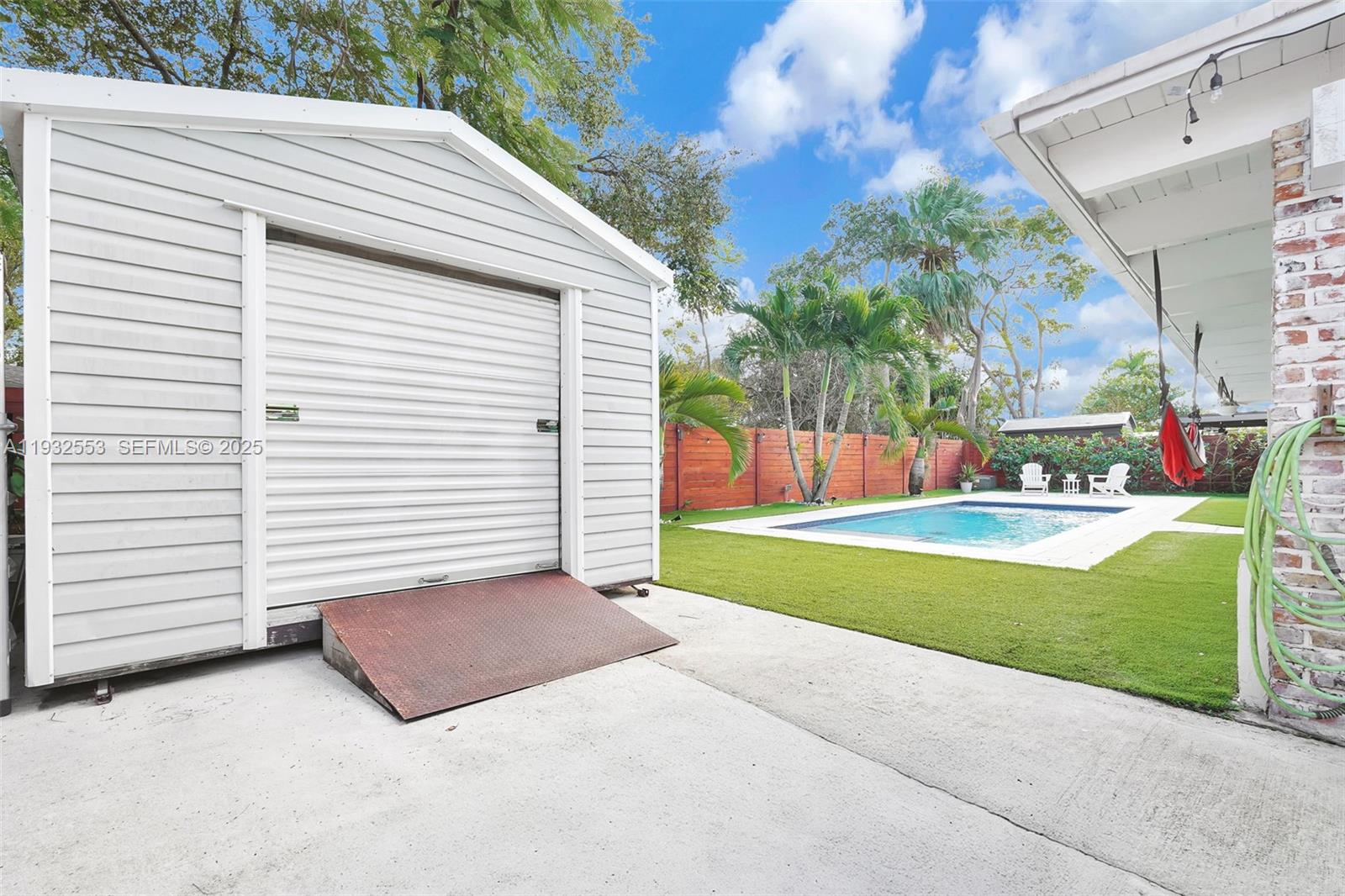 11561 Southwest 121st Avenue Miami, FL 33186 - Photo 11 of 30 a view of a backyard with a garden and plants