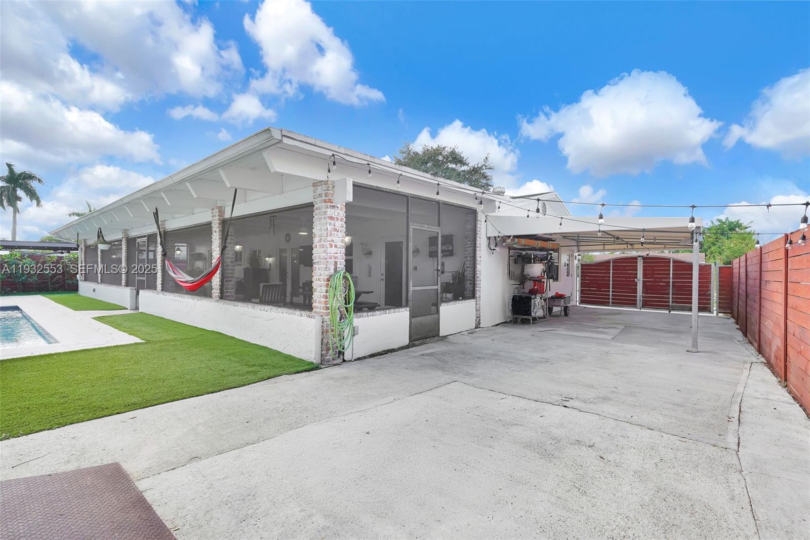 11561 Southwest 121st Avenue Miami, FL 33186 - Photo 12 of 30 a view of a house with backyard and porch