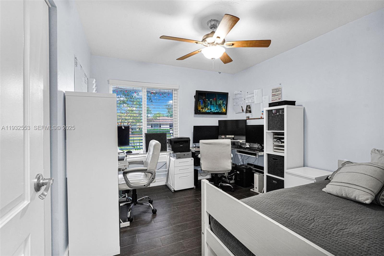 11561 Southwest 121st Avenue Miami, FL 33186 - Photo 15 of 30 a living room with furniture a fireplace and a flat screen tv