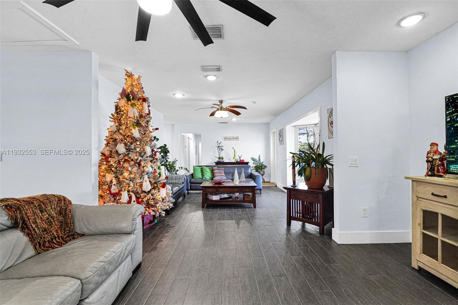 11561 Southwest 121st Avenue Miami, FL 33186 - Photo 19 of 30 a living room with furniture and a fireplace
