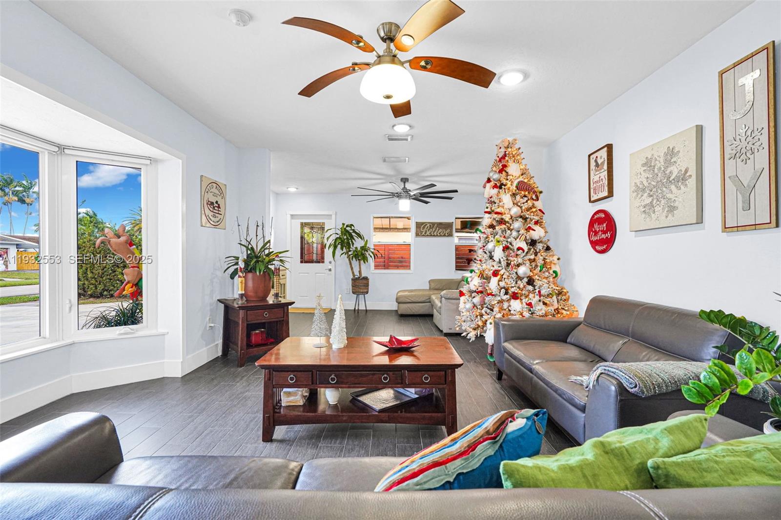 11561 Southwest 121st Avenue Miami, FL 33186 - Photo 21 of 30 a living room with furniture and a potted plant
