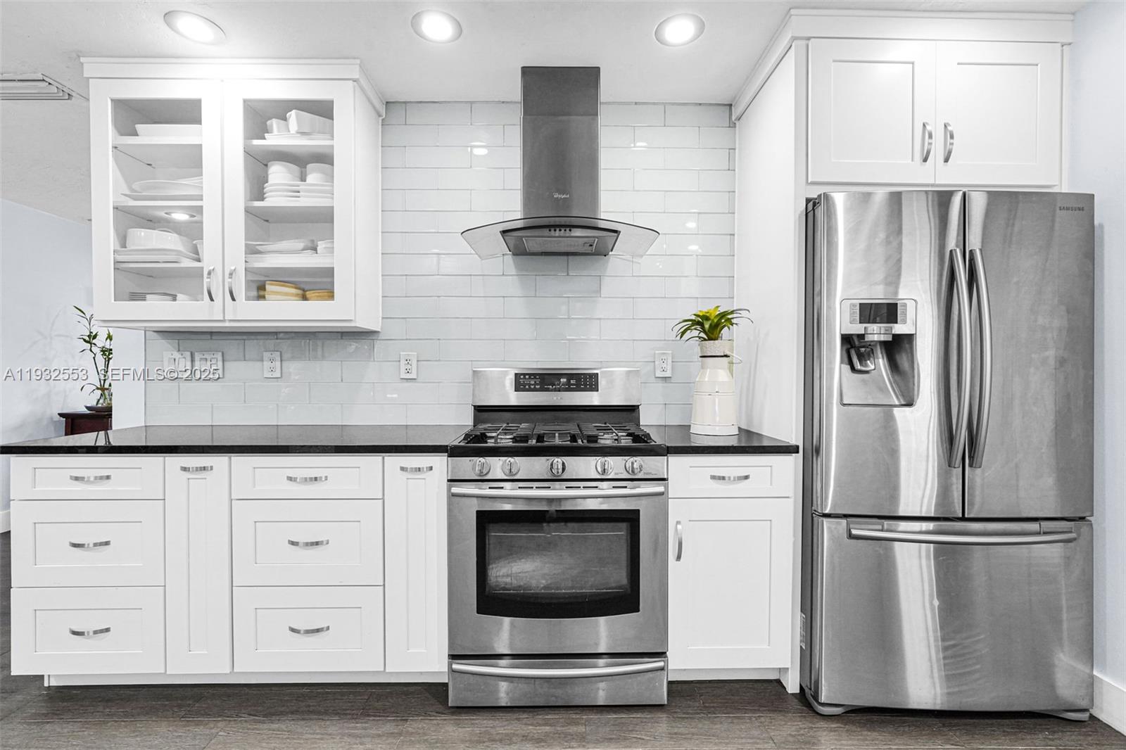 11561 Southwest 121st Avenue Miami, FL 33186 - Photo 25 of 30 a kitchen with appliances and cabinets