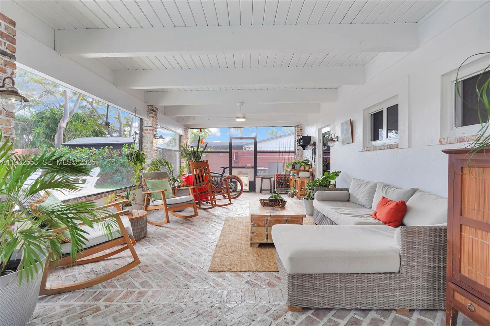 11561 Southwest 121st Avenue Miami, FL 33186 - Photo 4 of 30 a living room with furniture and a large window