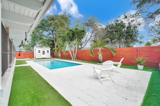a view of a house with swimming pool