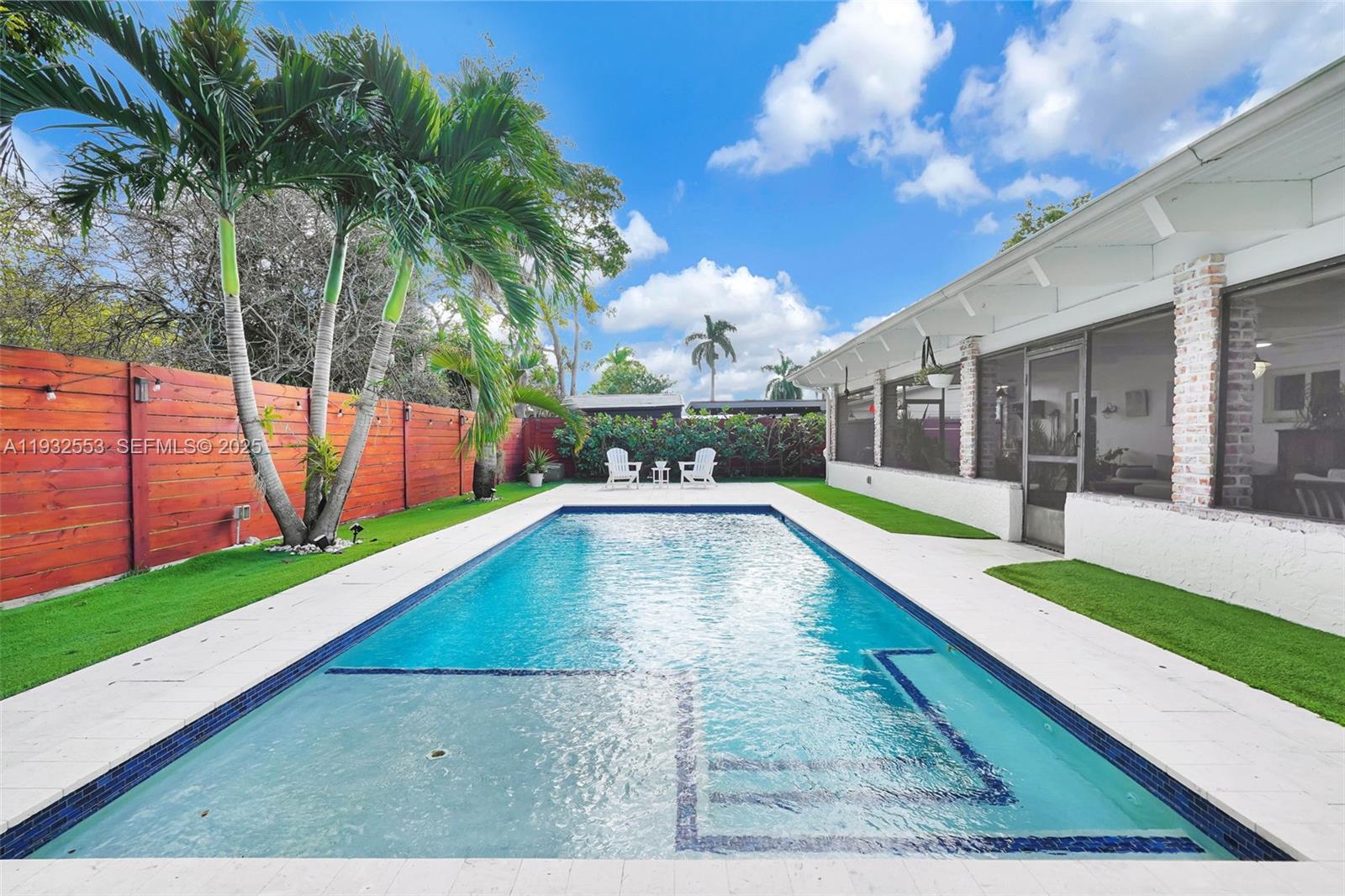 11561 Southwest 121st Avenue Miami, FL 33186 - Photo 9 of 30 a view of swimming pool with a yard