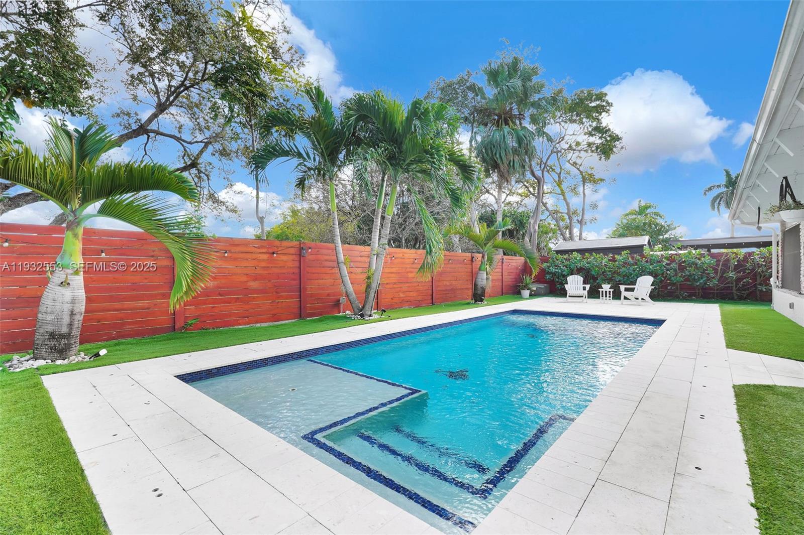 11561 Southwest 121st Avenue Miami, FL 33186 - Photo 10 of 30 a view of a pool with a yard