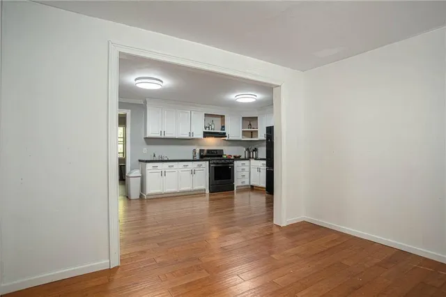 a view of kitchen with wooden floor