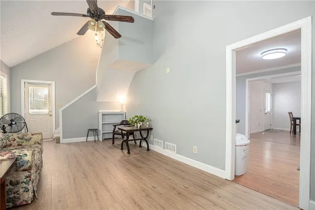 a view of a livingroom with furniture and wooden floor