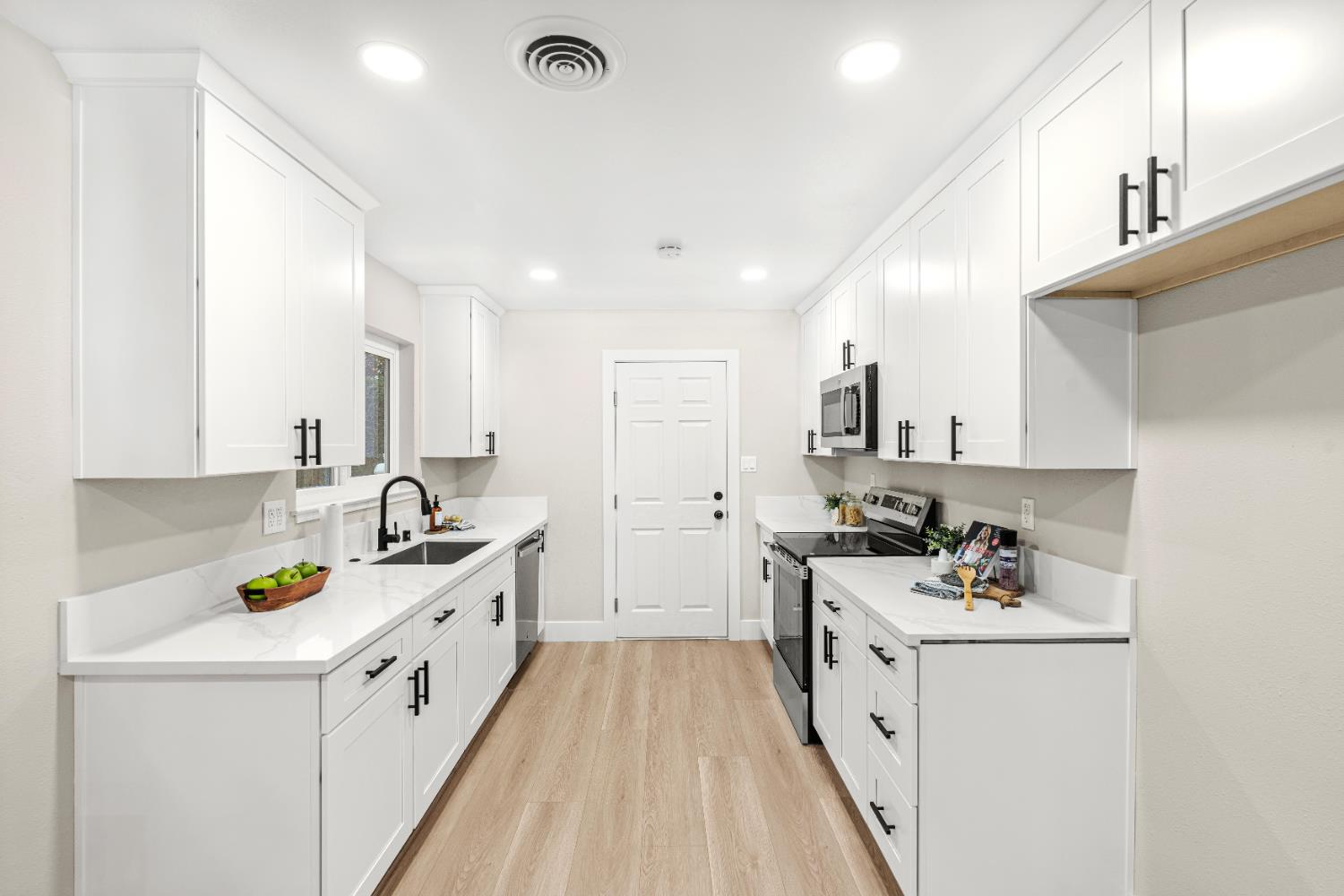 5610 Millburn Street Carmichael, CA 95608 - Photo 11 of 44 a kitchen with sink a stove and cabinets