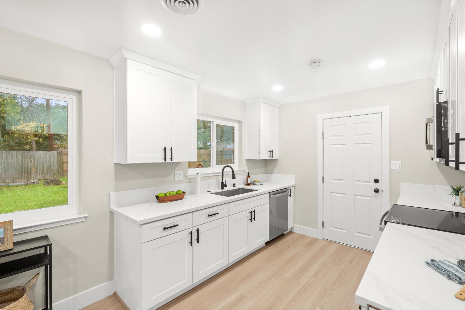 5610 Millburn Street Carmichael, CA 95608 - Photo 12 of 44 a kitchen that has a sink and a stove in it