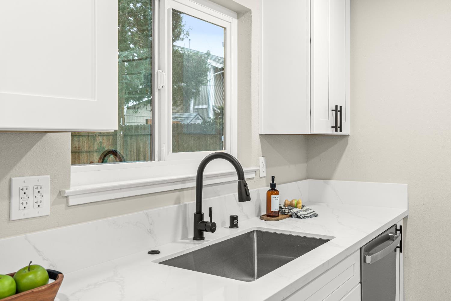 5610 Millburn Street Carmichael, CA 95608 - Photo 14 of 44 a kitchen with a sink and a potted plant