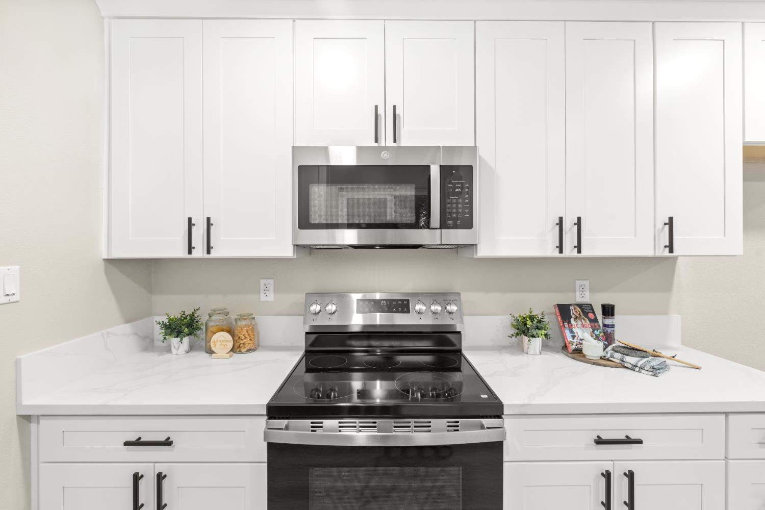5610 Millburn Street Carmichael, CA 95608 - Photo 15 of 44 a kitchen with stainless steel appliances granite countertop a sink stove and microwave