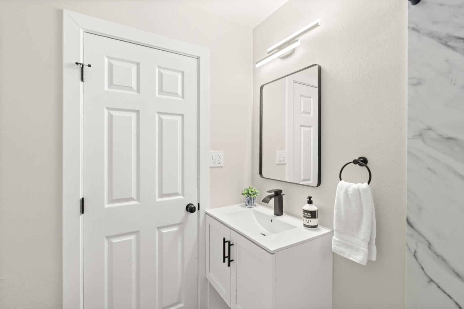 5610 Millburn Street Carmichael, CA 95608 - Photo 22 of 44 a bathroom with a sink and a mirror