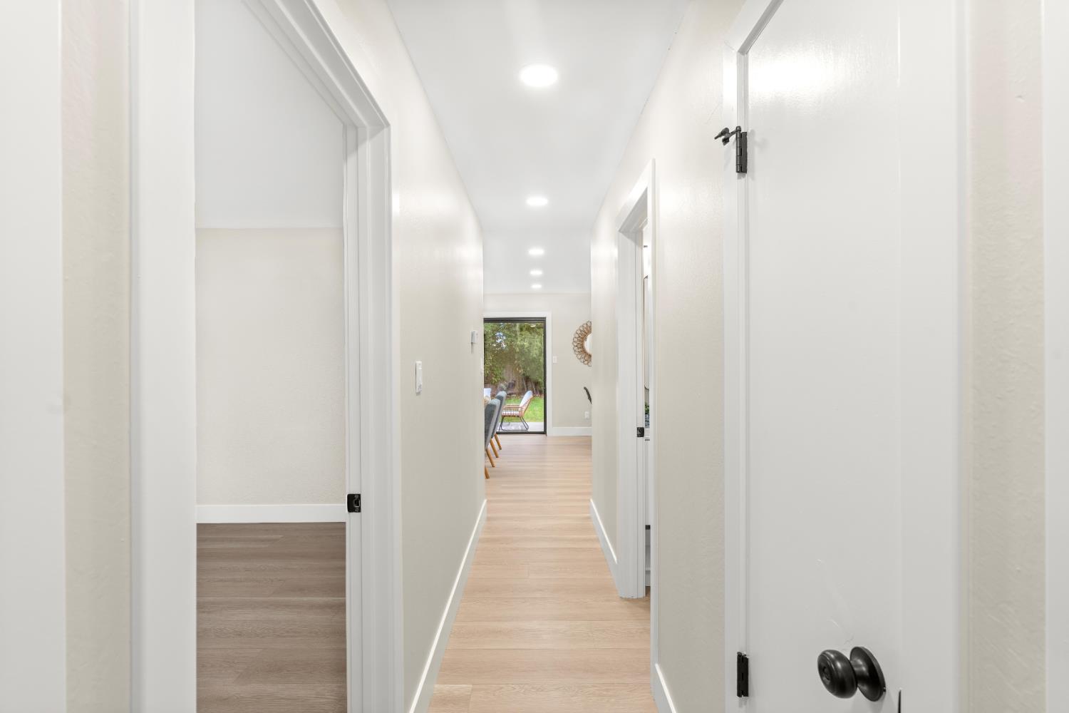 5610 Millburn Street Carmichael, CA 95608 - Photo 23 of 44 a view of a hallway with wooden floor