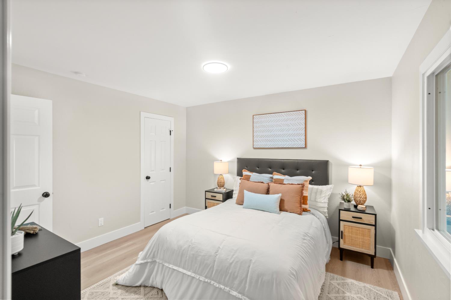 5610 Millburn Street Carmichael, CA 95608 - Photo 25 of 44 a bedroom with a bed and a night stand