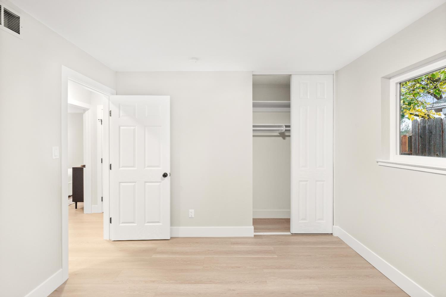 5610 Millburn Street Carmichael, CA 95608 - Photo 32 of 44 a view of a hallway with wooden floor and closet area