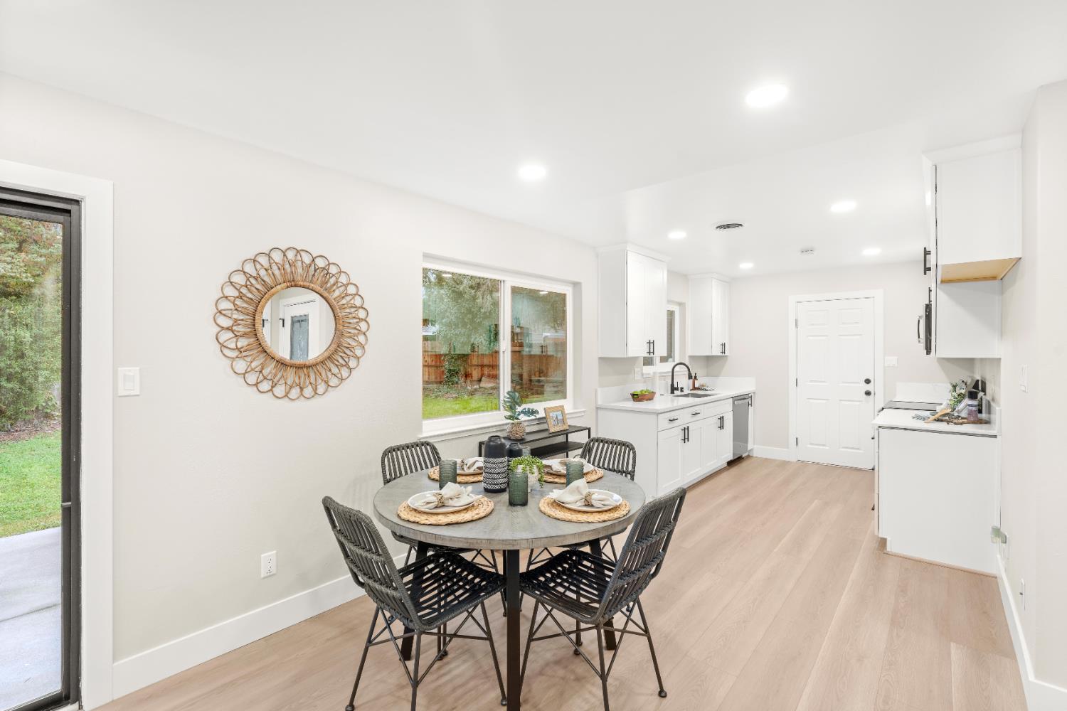 5610 Millburn Street Carmichael, CA 95608 - Photo 8 of 44 a kitchen with a table and chairs in it