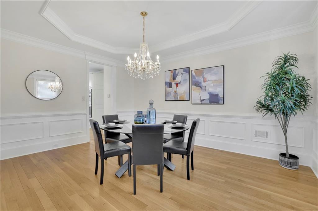 2430 Stonevalley Lane Cumming, GA 30041 - Photo 13 of 45 a view of a dining room with furniture and wooden floor