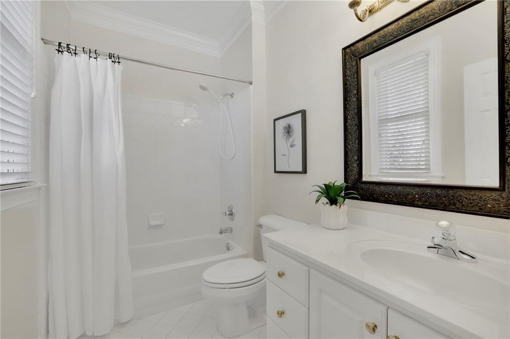 2430 Stonevalley Lane Cumming, GA 30041 - Photo 16 of 45 a bathroom with a sink toilet and shower