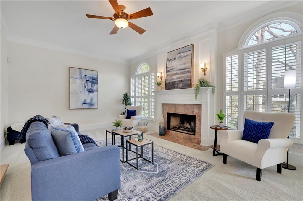 2430 Stonevalley Lane Cumming, GA 30041 - Photo 17 of 45 a living room with furniture and a fireplace