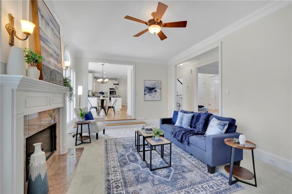 2430 Stonevalley Lane Cumming, GA 30041 - Photo 18 of 45 a living room with furniture and a fireplace
