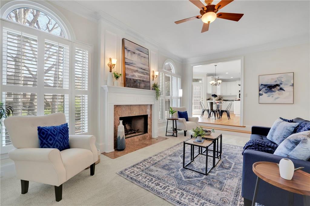 2430 Stonevalley Lane Cumming, GA 30041 - Photo 19 of 45 a living room with furniture and a fireplace