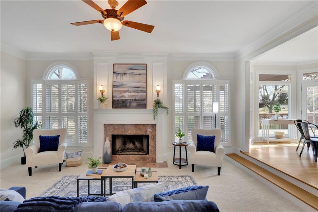 2430 Stonevalley Lane Cumming, GA 30041 - Photo 20 of 45 a living room with furniture and a fireplace