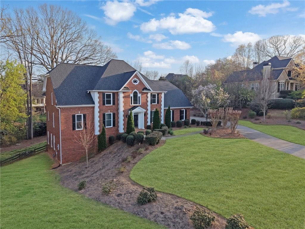 2430 Stonevalley Lane Cumming, GA 30041 - Photo 2 of 45 a front view of a house with garden